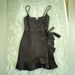 Black shirt dress. Tie on the side.